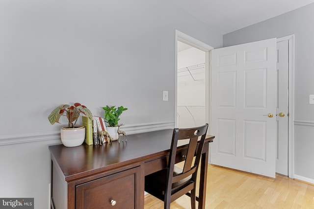 office with light hardwood / wood-style floors