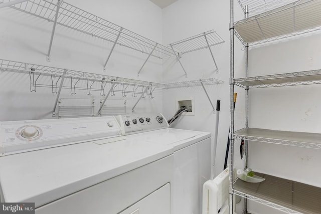 laundry area with washing machine and clothes dryer