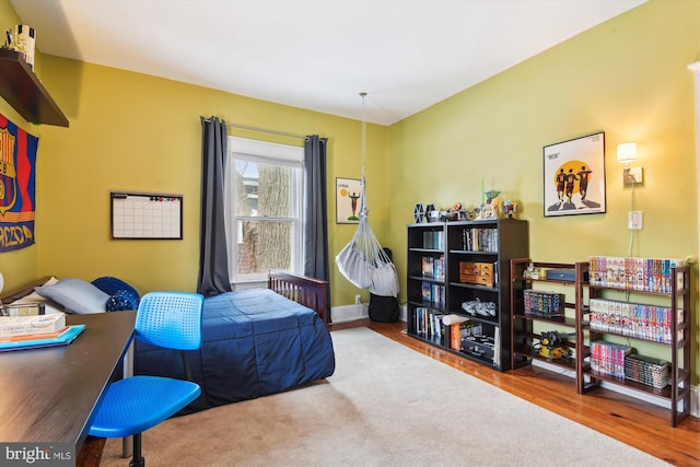 bedroom with wood-type flooring