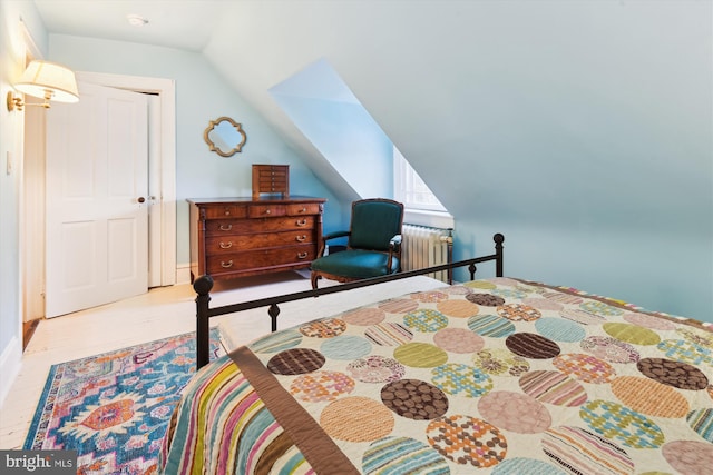 bedroom with radiator and vaulted ceiling