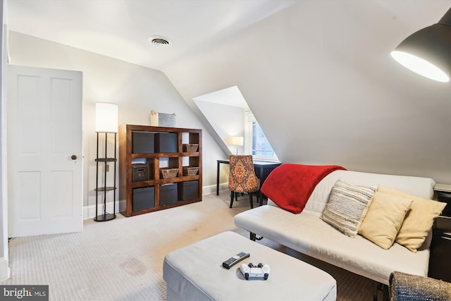 carpeted living room featuring vaulted ceiling