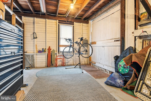 interior space featuring wooden walls