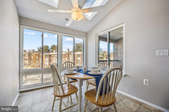 dining space featuring vaulted ceiling and ceiling fan