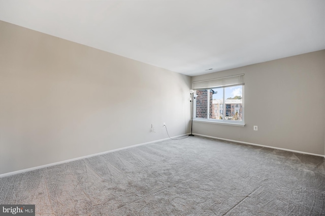 empty room with carpet flooring