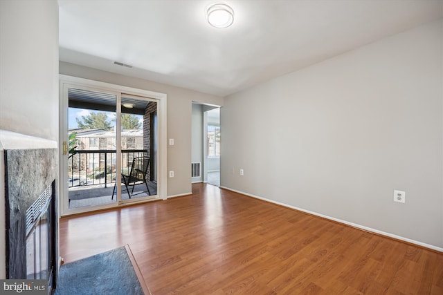 empty room with wood-type flooring