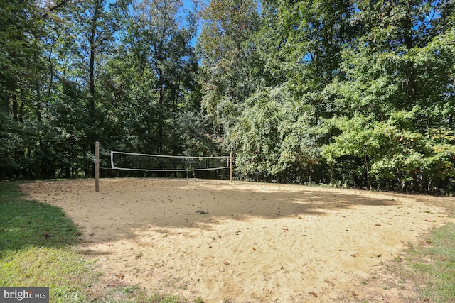 view of home's community featuring volleyball court