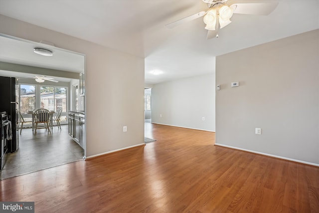 empty room featuring hardwood / wood-style flooring and ceiling fan