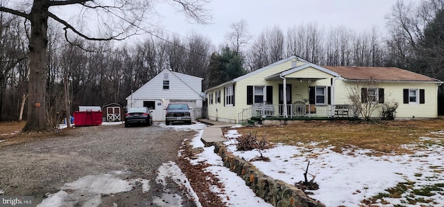 view of front of property featuring a garage and a porch