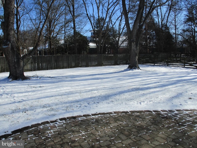 view of yard layered in snow