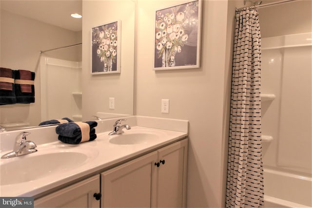 bathroom with vanity and shower / tub combo with curtain