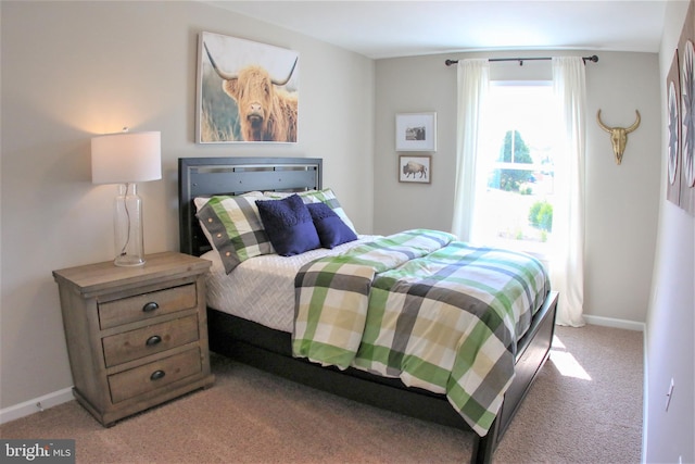 bedroom featuring light carpet