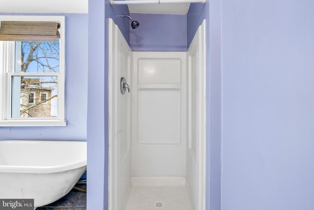 bathroom featuring plus walk in shower and tile patterned floors