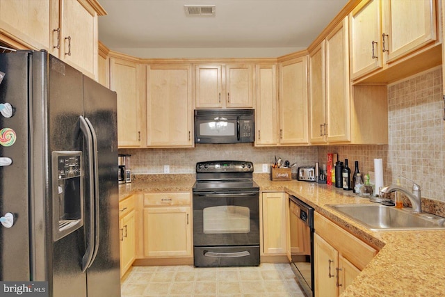 kitchen with light brown cabinetry, sink, backsplash, and black appliances