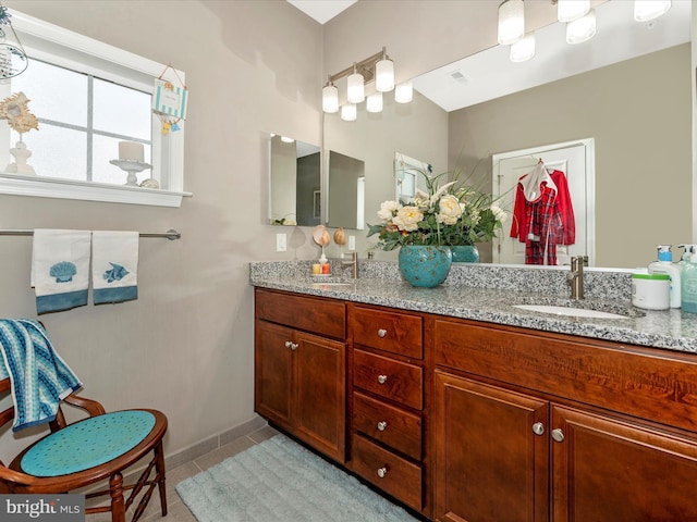 bathroom featuring vanity and tile patterned flooring