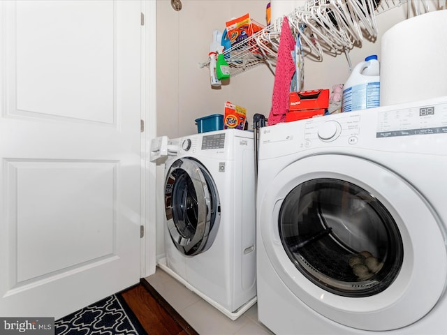 clothes washing area with washer and dryer