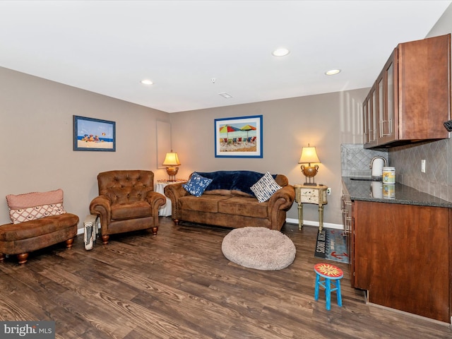 living room with dark wood-type flooring and sink