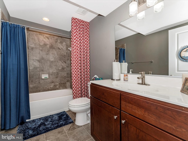 full bathroom with tile patterned floors, toilet, shower / bath combo with shower curtain, and vanity