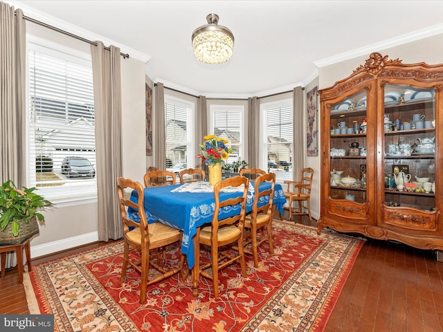 dining room featuring ornamental molding and a chandelier