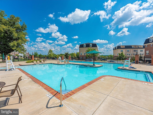 view of swimming pool featuring a patio area