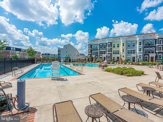 view of swimming pool featuring a patio