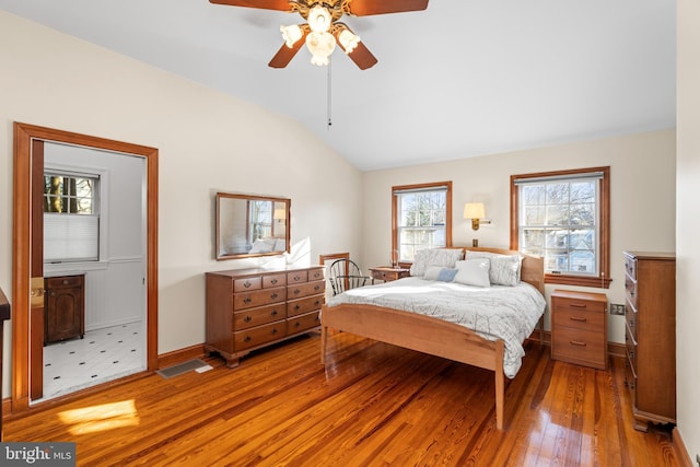 bedroom featuring ceiling fan, vaulted ceiling, and light wood-type flooring