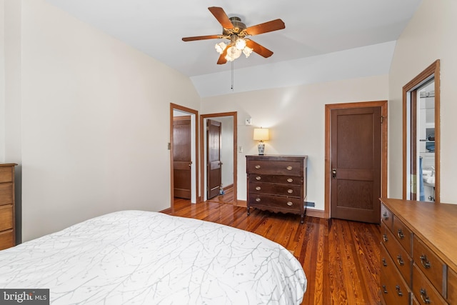 bedroom with ceiling fan, lofted ceiling, and dark hardwood / wood-style floors