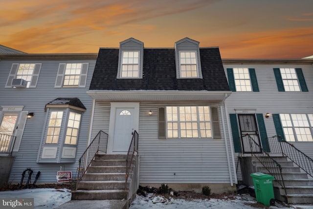 view of front of house featuring cooling unit