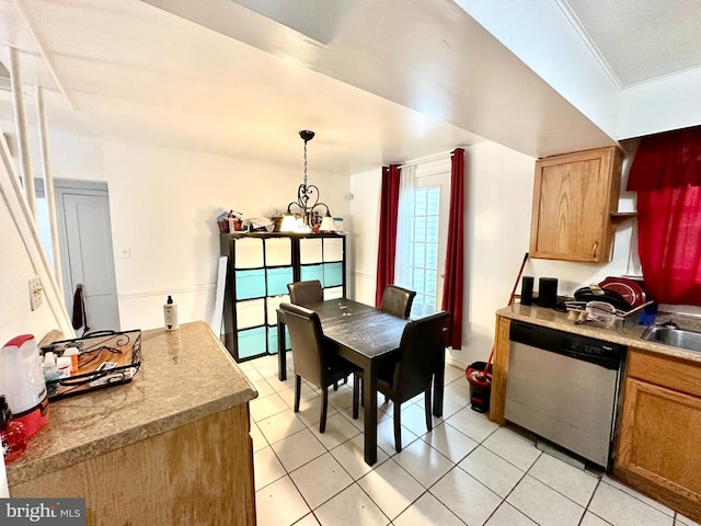 kitchen with stainless steel dishwasher, hanging light fixtures, ornamental molding, a chandelier, and light tile patterned floors