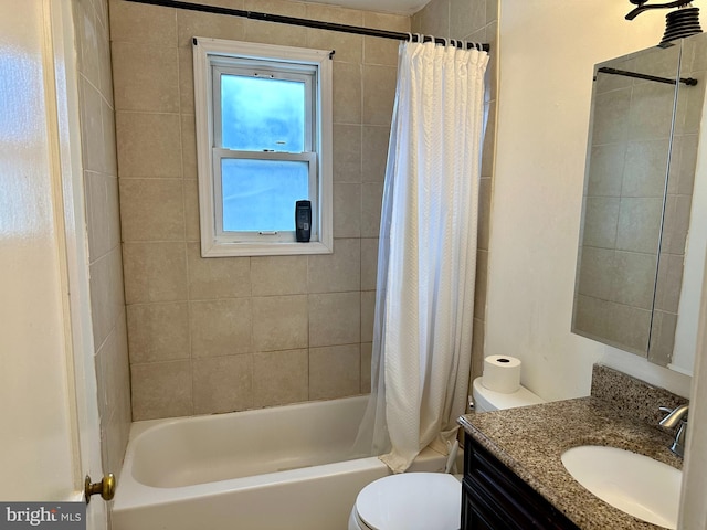 full bathroom featuring toilet, vanity, and shower / bathtub combination with curtain