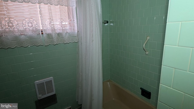 bathroom featuring shower / bath combination with curtain