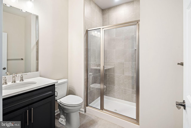 bathroom with vanity, toilet, an enclosed shower, and tile patterned flooring