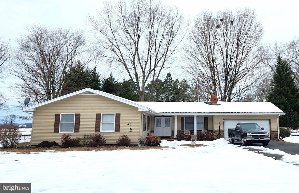 ranch-style home featuring a garage