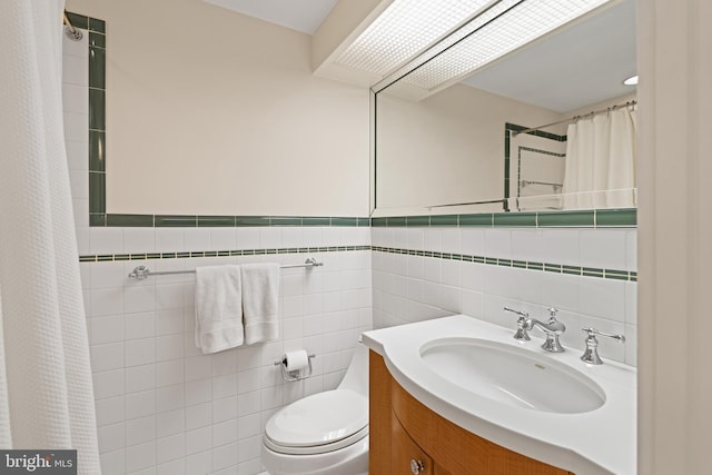 bathroom featuring tile walls, vanity, toilet, and a shower with shower curtain