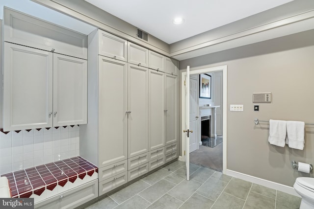 mudroom with light tile patterned floors