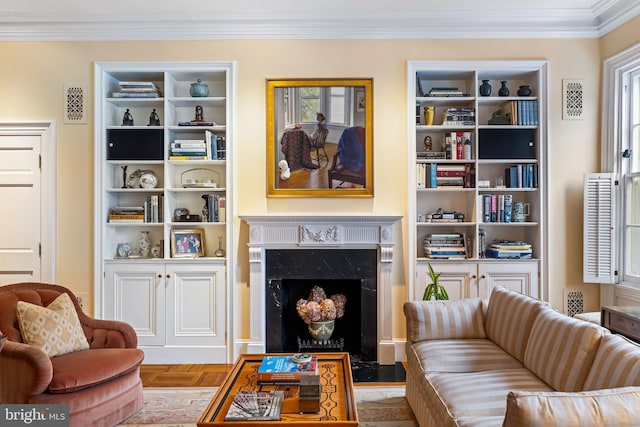 living room featuring ornamental molding, light parquet flooring, and a high end fireplace