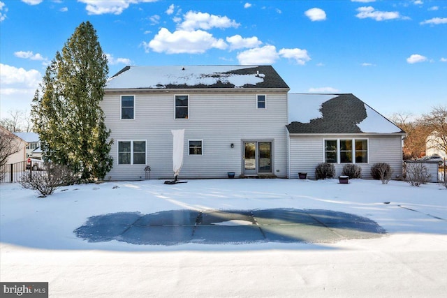 view of snow covered house