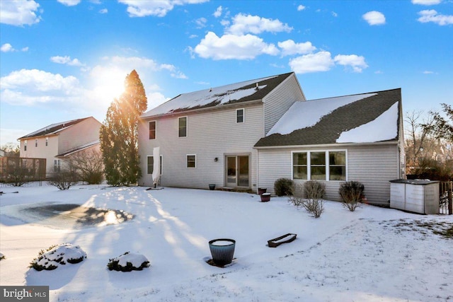 view of snow covered house