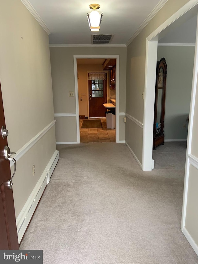 hallway featuring a baseboard heating unit, ornamental molding, and light carpet