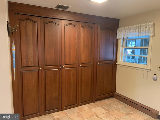 closet with a baseboard radiator