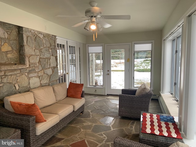 living room with ceiling fan and french doors