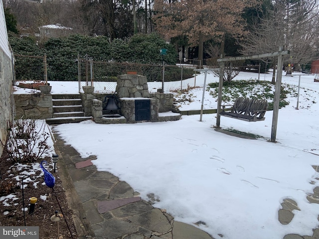 view of yard covered in snow