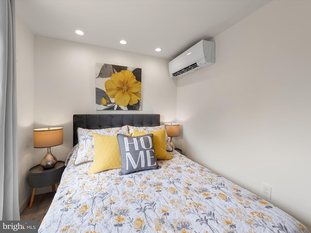 bedroom featuring a wall unit AC