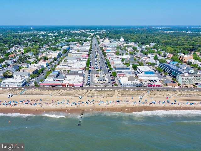 bird's eye view featuring a water view and a view of the beach