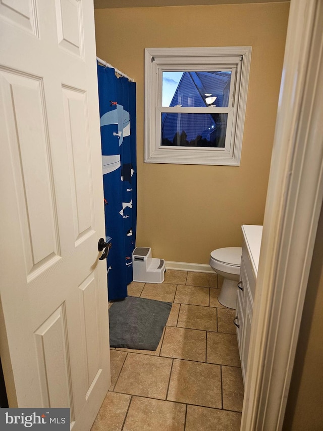 bathroom featuring toilet and vanity