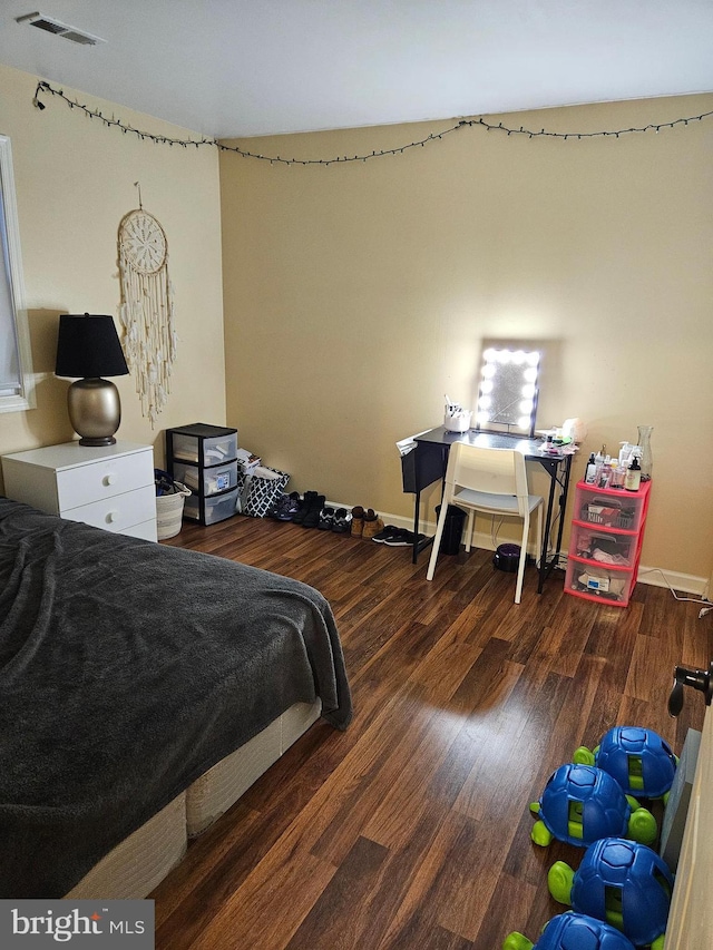 bedroom featuring dark hardwood / wood-style floors