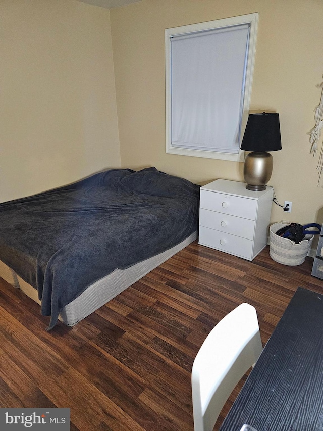 bedroom featuring dark hardwood / wood-style floors