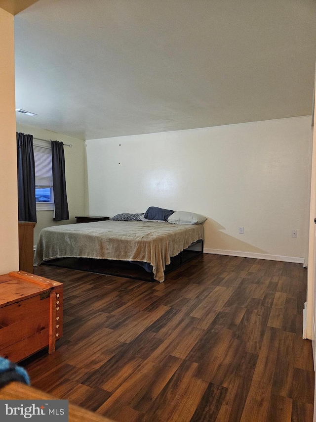 bedroom featuring dark wood-type flooring