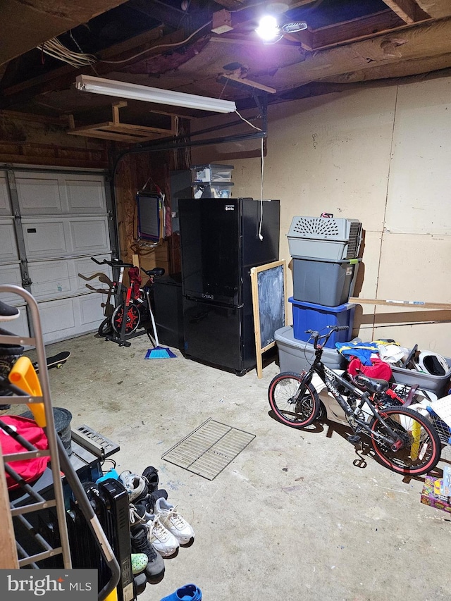 garage with black fridge