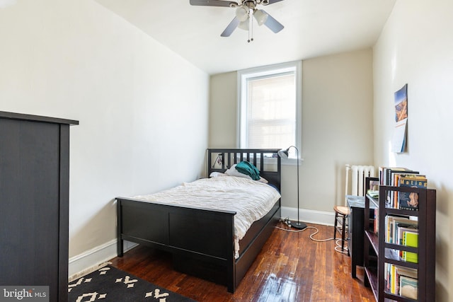 bedroom featuring ceiling fan and dark hardwood / wood-style flooring