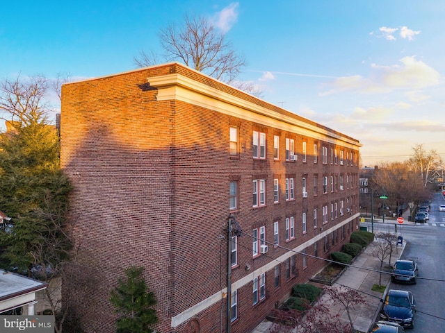 view of outdoor building at dusk